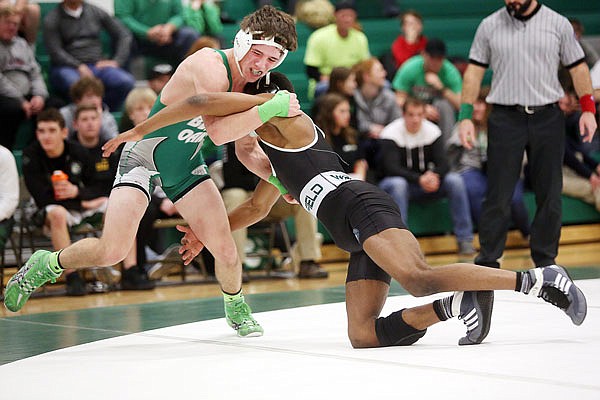 Ben Thomas of Blair Oaks wrestles Dylan Shotwell of Whitfield at 152 pounds during action Friday night in Wardsville.