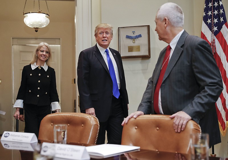 President Donald Trump, followed by Counselor to the President Kellyanne Conway, left, walks into the Roosevelt Room of the White House in Washington, Wednesday, Feb. 1, 2017, as David O'Steen of the National Right to Life watches. Trump discussed the nomination of Neil Gorsuch to the Supreme Court, setting up a fierce fight with Democrats over a jurist who could shape America's legal landscape for decades to come. 