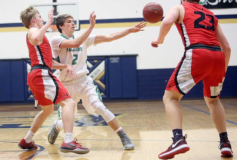 Dylan Skinner of Blair Oaks makes a pass during the Falcons' game against Union Saturday, Feb. 4, 2017 in the Central Bank Shootout at Rackers Fieldhouse in Jefferson City.