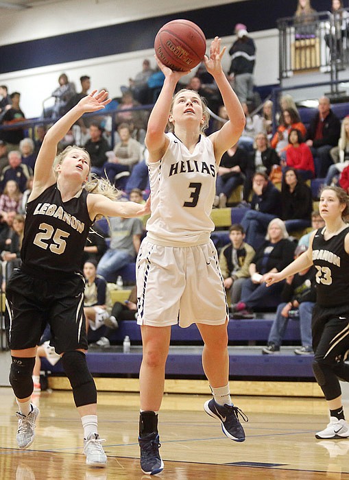 Crusader Morgan Wieberg, center, shoots the ball during a basketball game between Helias and Lebanon during the Central Bank Shootout at Rackers Fieldhouse in Jefferson City on Saturday, Feb. 4, 2017. 