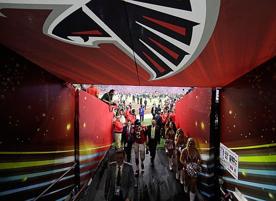 Falcons quarterback Matt Ryan walks back to the locker room after Sunday night's overtime loss to the Patriots in Super Bowl LI in Houston.