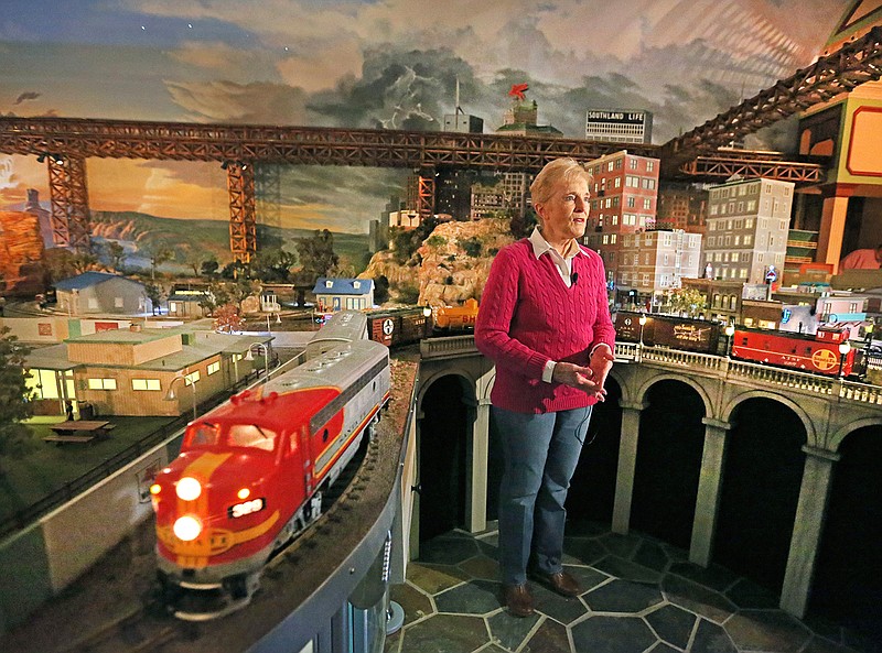In this Wednesday, Jan. 25, 2017 photo, Jane Sanders shows the model train display built by her husband Stephen in their Dallas home.