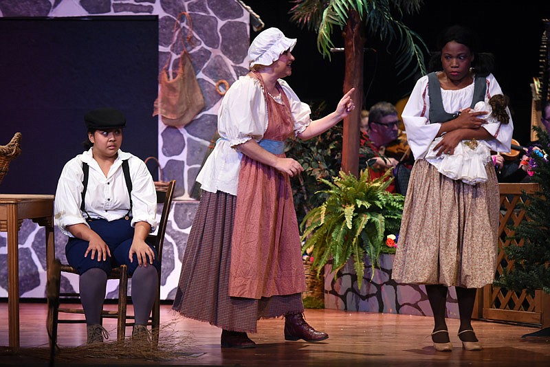 Hansel, played by Christine Nichols, sits fearfully while Mother, played by Kristin Chisham lectures her children about the dangers of the world as Gretel, played by Carline Waugh grasps her doll in fright during a rehearsal of Hansel and Gretel at Lincoln University Richardson Performing Arts Center Mitchell Auditorium on Monday, Feb. 6, 2017.