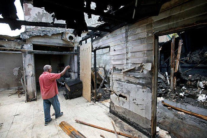 AP
Farhad Khan, who has attended the Islamic Center of Fort Pierce for more than seven years, shows members of the media its charred remains in 2016. Joseph Schneider, an ex-convict who investigators say confessed to setting fire to the mosque tied to the Orlando nightclub shooter, pleaded no contest to those charges Monday.