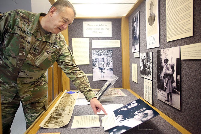 Maj. Gen. Steve Danner looks at a portrait of a World War I soldier who studied at Lincoln University, called the Lincoln Institute at the time, at the Black History Month display at the Missouri National Guard's Ike Skelton Training Site. The display will be open to the public for the month of February during normal business hours.
