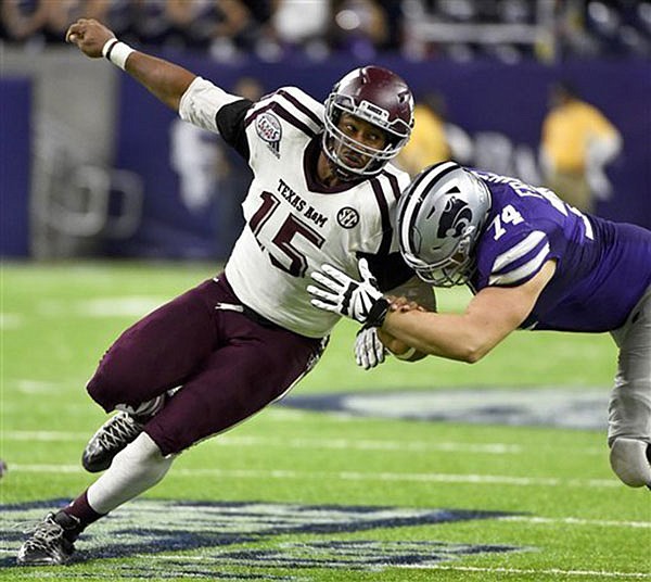 In this Dec. 28, 2016, file photo, Texas A&M's Myles Garrett tries to get around Kansas State offensive lineman Scott Frantz during the second half of the Texas Bowl in Houston. Garrett is among the top prospects in the upcoming NFL draft.