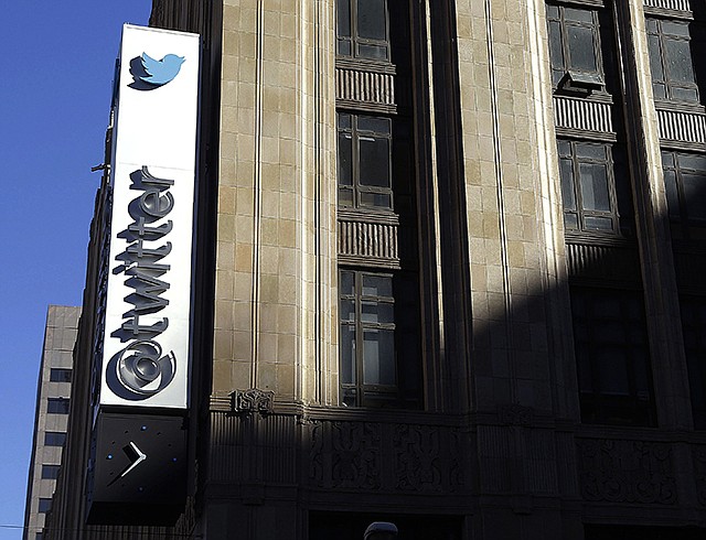 The sign outside of Twitter headquarters is shown in San Francisco. Twitter announced Thursday that the company is struggling to convert its headline omnipresence into cash and its profit expectations going forward is sending investors scattering.