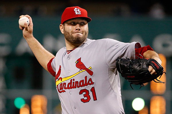 In this Sept. 28, 2015, file photo, Cardinals starting pitcher Lance Lynn warms up before a game against the Pirates in Pittsburgh. The Cardinals starting rotation is expected to receive a boost in the return of Lynn. The right-hander missed all of last season following elbow surgery.