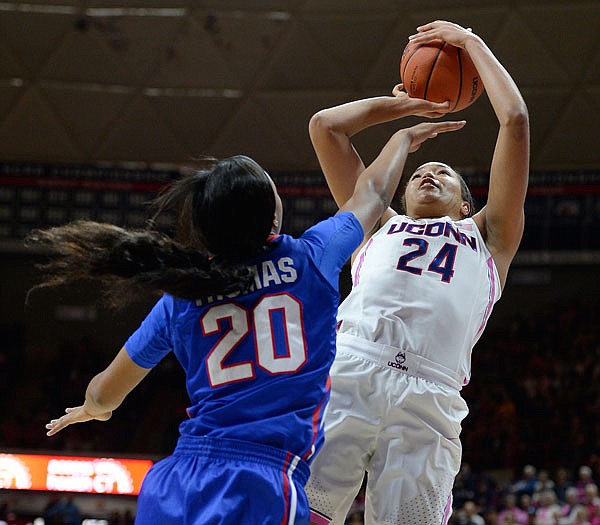 Connecticut's Napheesa Collier shoots as SMU's Dai'ja Thomas defends in the first half of last Friday's game in Storrs, Conn. UConn is looking to extend its win streak to 100 games tonight against South Carolina.
