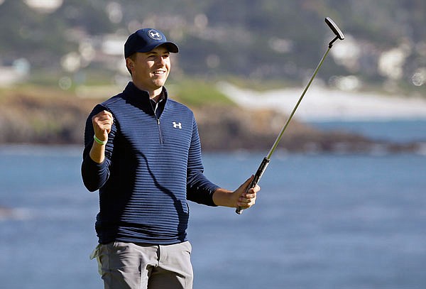 Jordan Spieth reacts on the 18th green of the Pebble Beach Golf Links after winning the AT&T Pebble Beach National Pro-Am on Sunday in Pebble Beach, Calif.