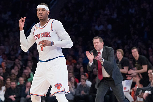 Knicks forward Carmelo Anthony and coach Jeff Hornacek react after Anthony makes a 3-pointer during the second half of last Friday's game against the Nuggets at Madison Square Garden in New York.