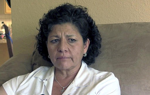  In this Tuesday, July 14, 2015 file photo from video, Tina Cordova talks of her late father, Anastacio Cordova, in her Albuquerque home. Cordova believes her father, who died in 2013 after suffering from multiple bouts of cancer, was affected by the atomic bomb Trinity Test in New Mexico since he lived in nearby Tularosa, N.M. as a child. 