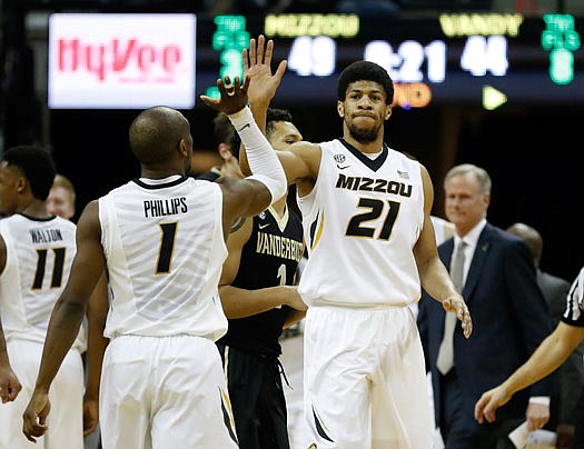 Missouri teammates Jordan Barnett and Terrence Phillips celebrate during the second half of Saturday's 72-52 win against Vanderbilt at Mizzou Arena.