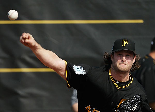 Pirates pitcher Gerrit Cole throws during a workout Tuesday at spring training in Bradenton, Fla.