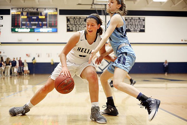 Ashley Rehagen of Helias controls the ball during Tuesday night's game against Father Tolton at Rackers Fieldhouse.