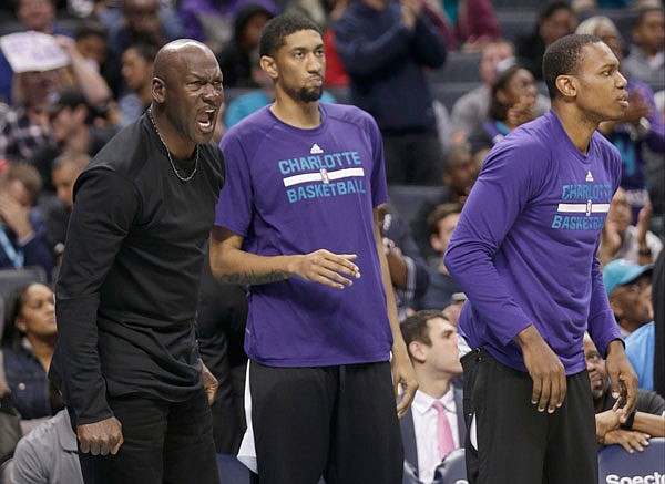 Hornets owner Michael Jordan shouts at an official in the second half of Monday's game against the Wizards in Charlotte, N.C.