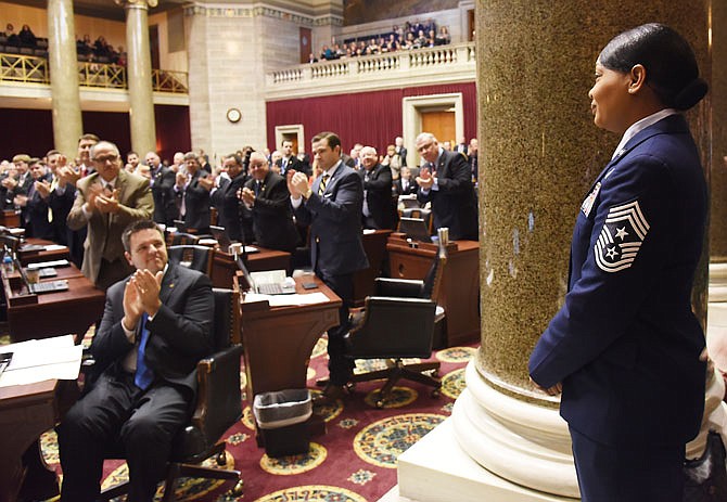 Chief Master Sgt. Melvina Smith receives a standing ovation from members of the Missouri House of Representatives on Tuesday during Military Appreciation Day. 