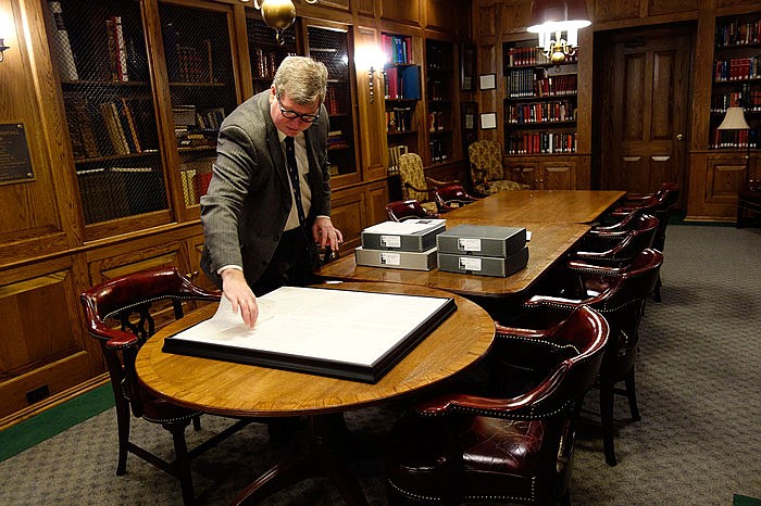 Tim Riley, director and chief curator of the National Churchill Museum at Westminster College, lays out pages of an essay written by former British stateman Winston Churchill in 1939. The essay discusses the possibility of life elsewhere in the Universe, and is a topic of an article by astrophysicist Mario Livio publishing today in the journal 'Nature."