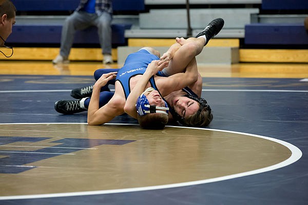 Randy Salaz of the Helias Crusaders works toward a pin during a match this season. Salaz qualified for the Class 3 state tournament, but will not wrestle due to an injury.