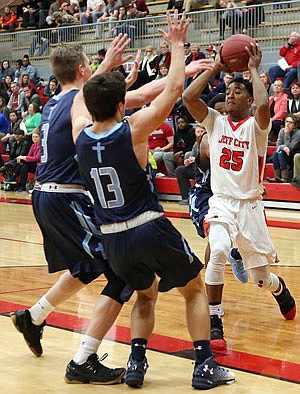 Kamari Balton of the Jays looks to make a pass during Wednesday night's game against Father Tolton at Fleming Fieldhouse.