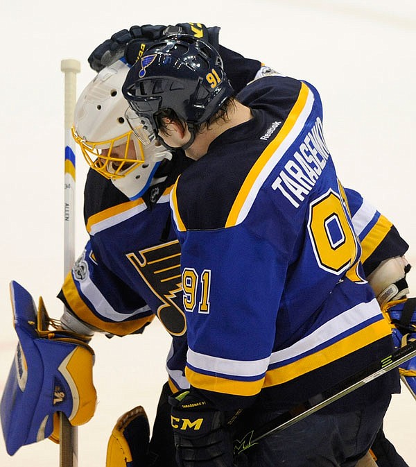 Vladimir Tarasenko congratulates Blues' goalie Jake Allen after Thursday night's win against the Canucks in St. Louis.