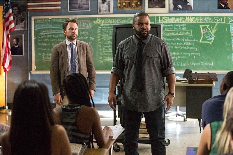 This image released by Warner Bros. Pictures shows Ice Cube, right, and Charlie Day in a scene from "Fist Fight." 