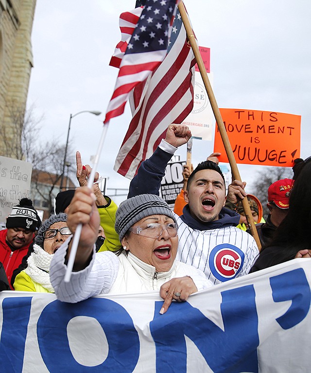 Protesters participate in a march aimed squarely at President Donald Trump's efforts to crack down on immigration Thursday in Chicago. Immigrants around the country stayed home from work and school Thursday, hoping to demonstrate their importance to America's economy and its way of life.