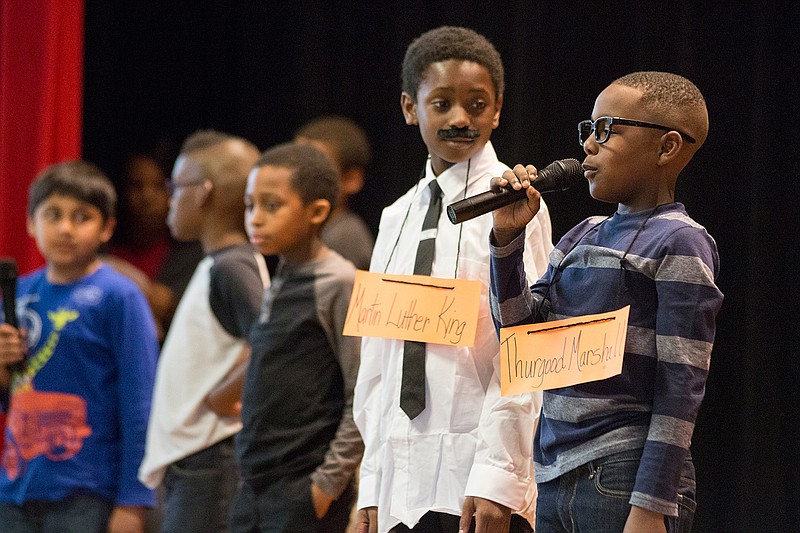 Wax figures of Martin Luther King, Jr. played by Jeremiah Jones, and Thurgood Marshall, played by Jayden Riley, discuss the civil rights movement on Friday. Kilpatrick Elementary students performed "Field trip to the Black History Wax Museum," a play where wax figures come to life to teach students about black history. 
