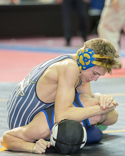 Jackson Careaga of Helias wrestles Calvin Obermark of Washington in quarterfinal action at the state wrestling championships Friday at Mizzou Arena in Columbia.