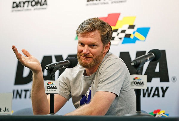 In this June 30 file photo, Dale Earnhardt Jr. gestures as he speaks during a news conference before the start of practice at Daytona International Speedway in Daytona Beach, Fla. NASCAR is making adjustments to its concussion testing after Earnhardt missed 18 races last season with a concussion. 