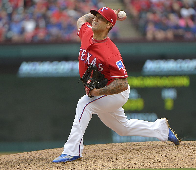 Texas Rangers relief pitcher Matt Bush throws during the eighth inning against the Toronto Blue Jays in Game 2 of the American League Division Series at Globe Life Park in Arlington, Texas, on October 7, 2016. Bush has overcome an alcohol problem and a prison stint to become a solid member of the Rangers on and off the field. 