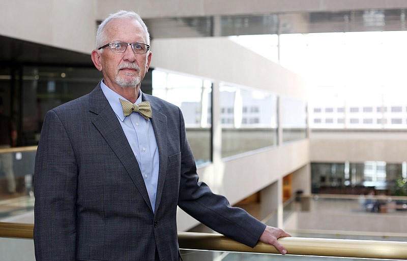 Harry Otto poses for a portrait in the Truman Building. Otto is director of legislative affairs at the Missouri Department of Economic Development.