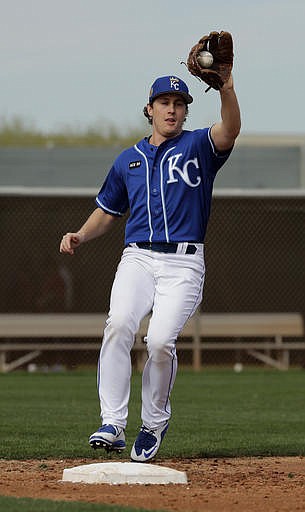 Kansas City Royals pitcher Seth Maness catches a ball during baseball spring training Tuesday, Feb. 14, 2017, in Surprise, Ariz. 