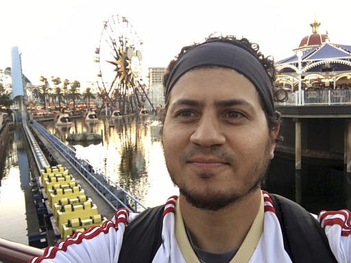 This Aug. 2016 photo provided by Haisam Elsharkawi, shows Haisam Elsharkawi, a self-employed businessman from Anaheim, Calif., poses for a selfie at Disneyland. Elsharkawi says he was detained on Feb. 9, by U.S. Customs and Border Protection at Los Angeles International Airport while he tried to board a flight to Saudi Arabia because he refused to unlock his cell phone. Watchdog groups that monitor digital privacy rights are concerned about an increase in electronic media searches at immigration checkpoints in U.S. Airports. 