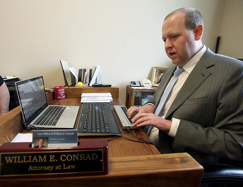 In this Wednesday, Feb. 8, 2017 photo, attorney Will Conrad types on a special key board at his office in Waco, Texas. People who know the 34-year-old Dallas native and view the relative ease he gets around the courtroom say they tend to forget Conrad is blind.