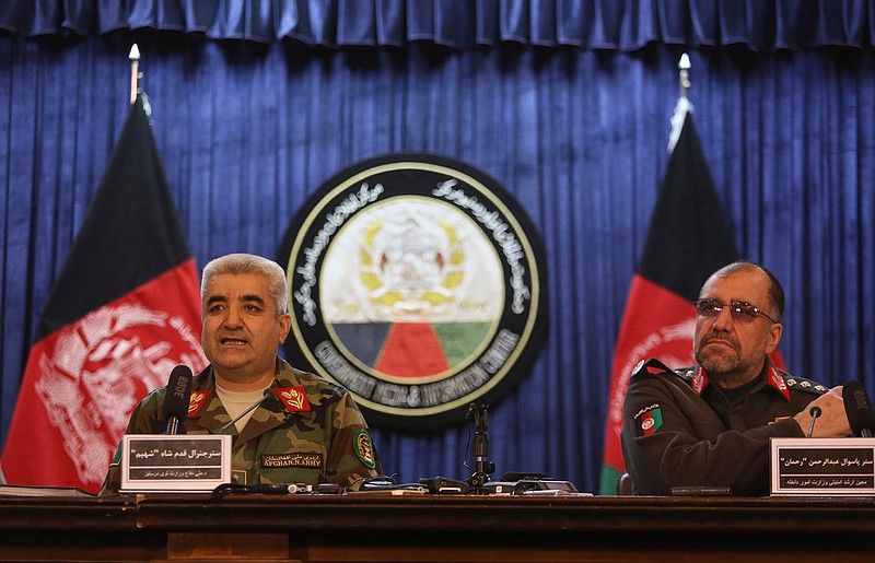 Afghan Army Chief of Staff General Qadam Shah Shahim, left, and Deputy Interior Minister General Abdul Rahman Rahman, give a news conference, in Kabul, Afghanistan, Saturday, Feb. 18, 2017. The Afghan government has summoned Pakistan's ambassador in protest of recent shelling in Afghanistan's eastern provinces. 