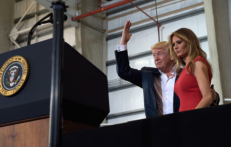 President Donald Trump and first lady Melania Trump arrive to speak at his "Make America Great Again Rally" at Orlando-Melbourne International Airport in Melbourne, Fla., Saturday, Feb. 18, 2017. 