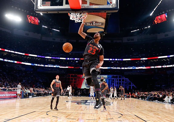 Western Conference forward Anthony Davis of the Pelicans dunks during the first half Sunday in the NBA All-Star Game in New Orleans.