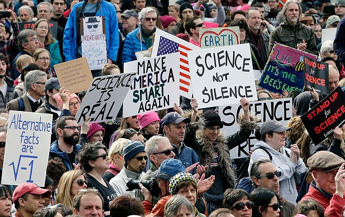 Members of the scientific community, environmental advocates, and supporters demonstrate Sunday, Feb. 19, 2017 in Boston, to call attention to what they say are the increasing threats to science and scientific research under the administration of President Donald Trump.