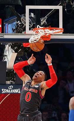 Western Conference guard Russell Westbrook watches his dunk during Sunday night's NBA All-Star Game in New Orleans.