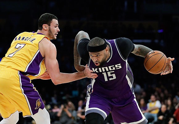 DeMarcus Cousins of the Kings drives past Larry Nance Jr. of the Lakers during a game last week in Los Angeles. The Kings have dealt Cousins to the Pelicans.