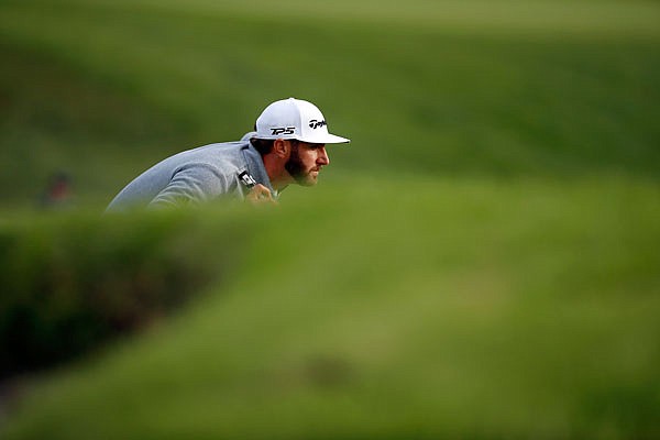 Dustin Johnson lines up his putt on the 16th green during Sunday's final round of the Genesis Open at Riviera Country Club in the Pacific Palisades area of Los Angeles.