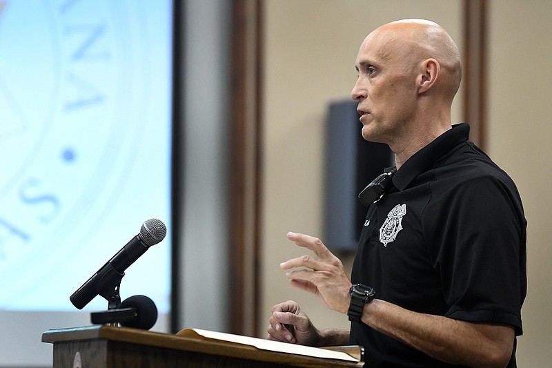 Texarkana, Ark., Animal Control Officer Richard Hinton explains the importance of passing a new city ordinance concerning dogs being kept on chains during the Board of Directors meeting Tuesday at City Hall. 