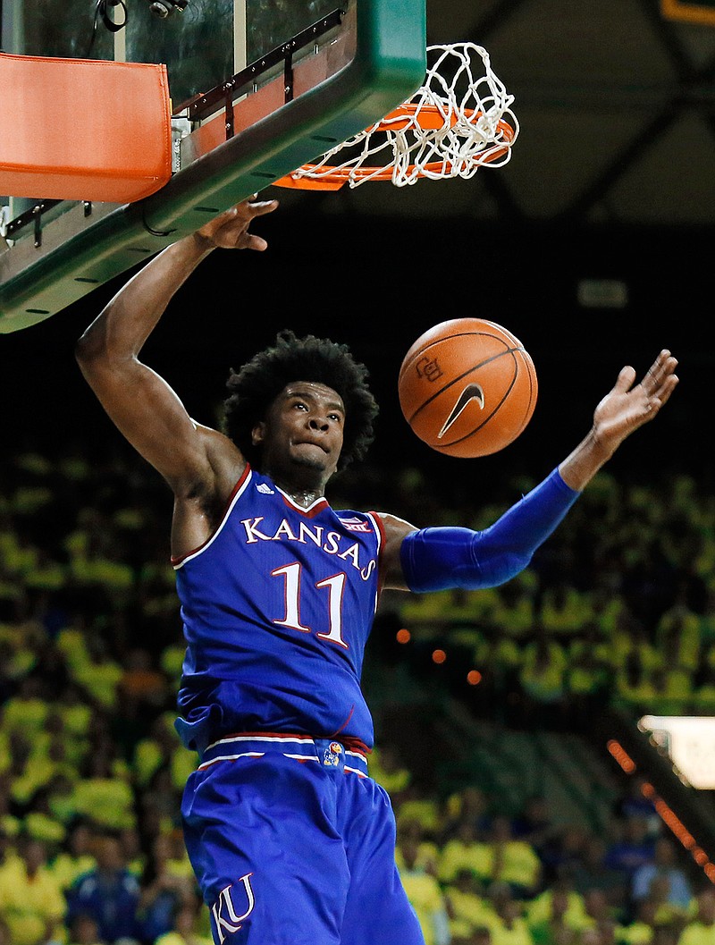 Kansas guard Josh Jackson (11) dunks against Baylor in the first half of an NCAA college basketball game, Saturday, Feb. 18, 2017, in Waco, Texas. 