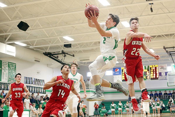 Dylan Skinner of Blair Oaks drives past Dixon's Gavin Barnhart (22) to score a basket during the first half of Tuesday's first-round game in the Class 3 District 9 Tournament at Wardsville.
