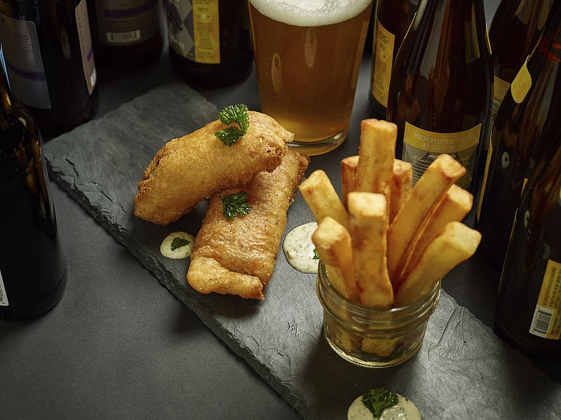 This Feb. 14, 2017 photo provided by The Culinary Institute of America shows fish and chips in Hyde Park, N.Y. This dish is from a recipe by the CIA.