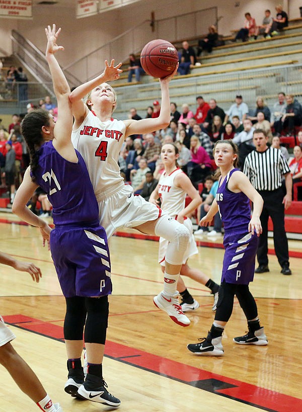 Lexy Haug of the Lady Jays puts up a shot in the lane against Pacific's Devon Fleming during the first half of Tuesday night's game at Fleming Fieldhouse. Haug, who scored a team-high 13 points, was one of five seniors honored prior to Tuesday's game, which Jefferson City won 48-44 to improve to 21-3.