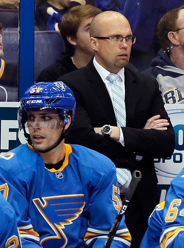 Blues coach Mike Yeo watches from the bench during the second period of a game earlier this month against the Maple Leafs in St. Louis.