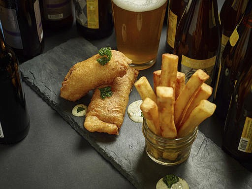 This Feb. 14, 2017 photo provided by The Culinary Institute of America shows fish and chips in Hyde Park, N.Y. This dish is from a recipe by the CIA. (Phil Mansfield/The Culinary Institute of America via AP)