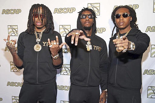 In this Feb. 7, 2015 file photo the three-member hip-hop group Migos pose at the Grammy Nominees Brunch in Beverly Hills, Calif. A Florida man is facing felony charges after police say a shot was fired during a fight between Migos and rapper Sean Kingston outside a Las Vegas Strip convention center, Tuesday, Feb. 21, 2017. Authorities said the shot was fired in the air and no one was reported to have been injured. (Photo by Omar Vega/Invision/AP, File)